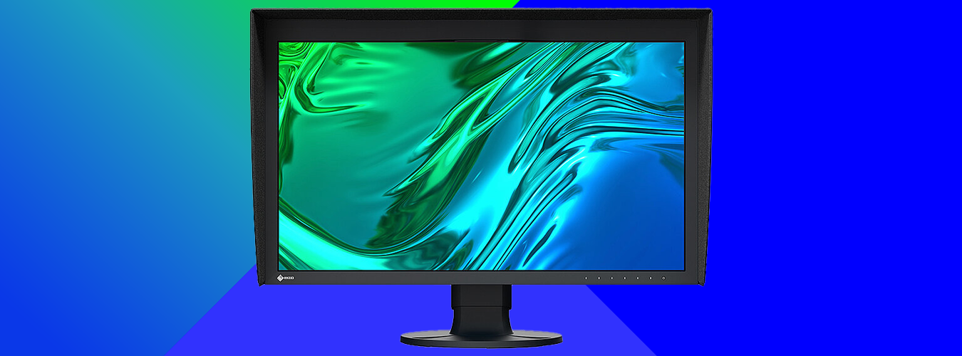 Black-framed computer monitor on a stand displaying an abstract, fluid pattern in green, teal, and blue tones, set against a geometric blue and green gradient background.
