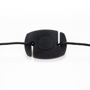 An image showing the weight on the USB-C cable for the Calibrite Display 123 which allows the device to be balanced and stay in place over a monitor screen during calibration of the screen.