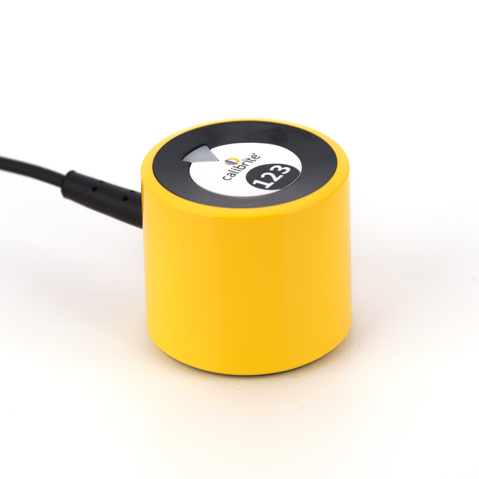 An image showing the Calibrite Display 123 which is a yellow, cylindrical device for calibrating the colour on your monitor.