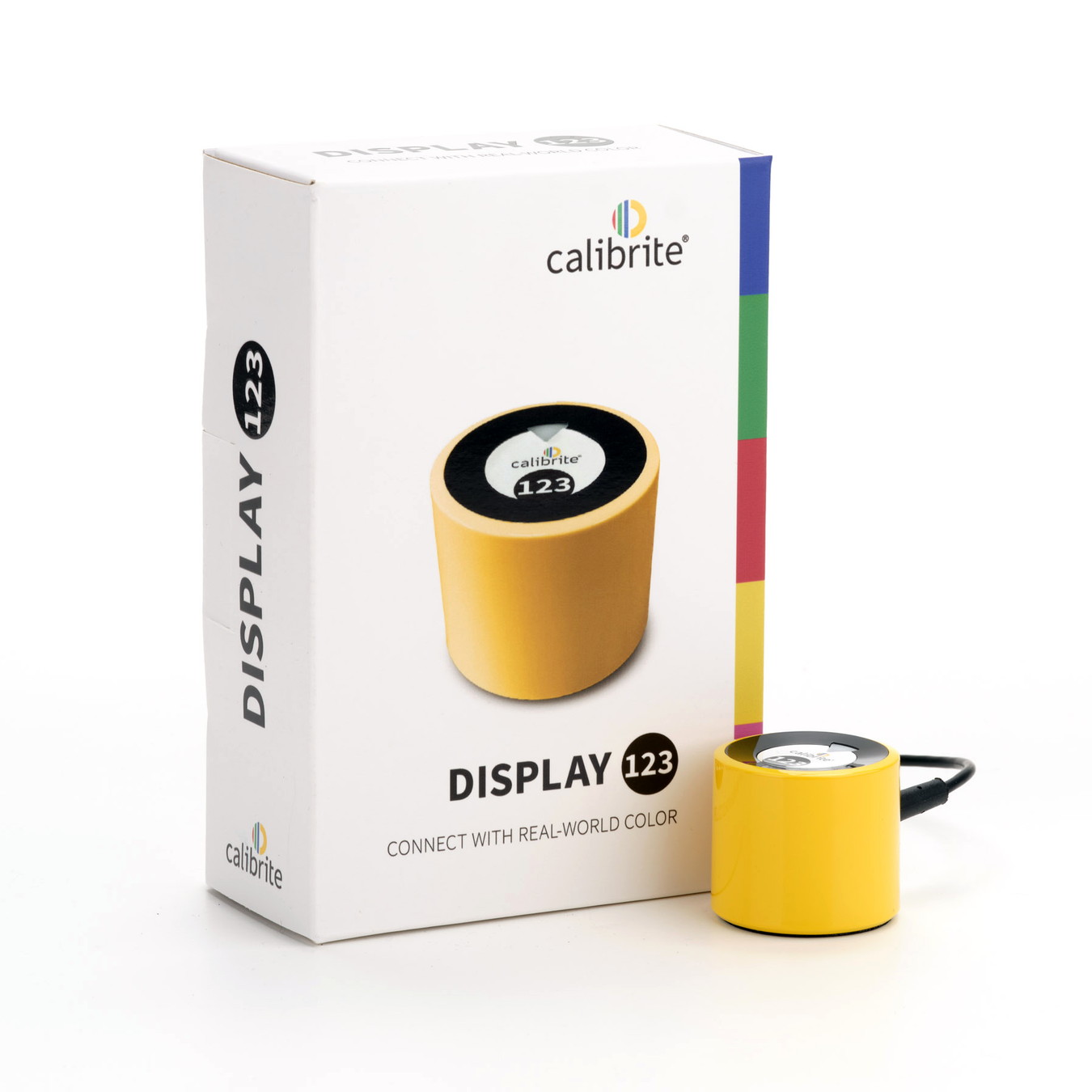 An image showing the Calibrite Display 123, a yellow, cylindrical device for calibrating the colour on your monitor, next to its cardboard packaging which shows the slogan "Connect with real-world color".