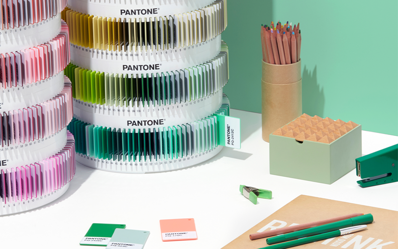 An image showing the PANTONE Matching System Plastic Standard Chips being used in a design environment, with each plastic chip having its own unique colour code. The collection can be used for colour selection and analysis for product design in the beauty, food & beverage, toy manufacture, medical and fashion industries.